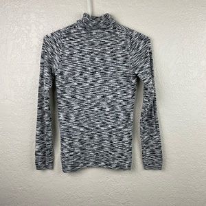 The limited turtleneck long sleeve tee top